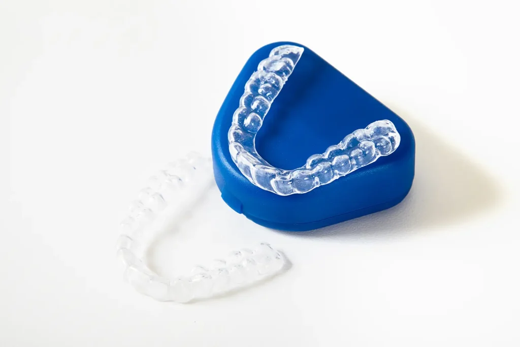 Night guards used to mitigate the effects of stress-related teeth grinding, a common issue linked to anxiety, recommended by Montana Center for Implants and Dentures.